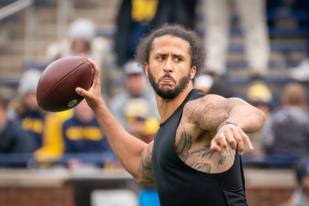 Colin Kaepernick participates in a throwing exhibition during half time of the Michigan spring football game at Michigan Stadium on April 2, 2022 in...