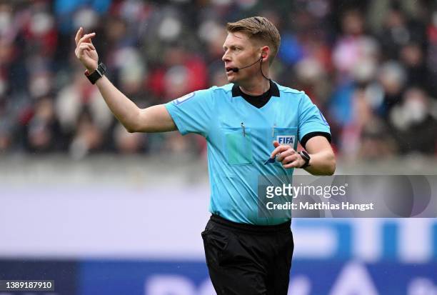 Referee Christian Dingert gestures during the Bundesliga match between Sport-Club Freiburg and FC Bayern München at Europa-Park Stadion on April 02,...