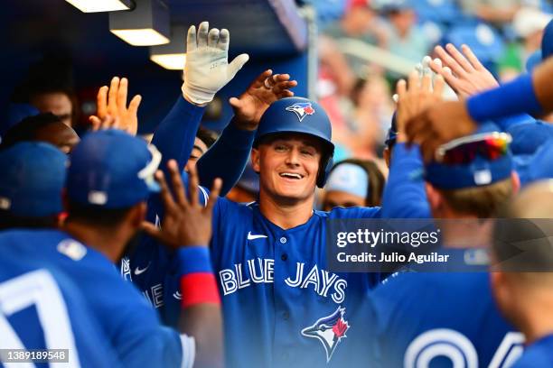 Matt Chapman of the Toronto Blue Jays celebrates with teammates after hitting a home run in the fifth inning against the Philadelphia Phillies during...