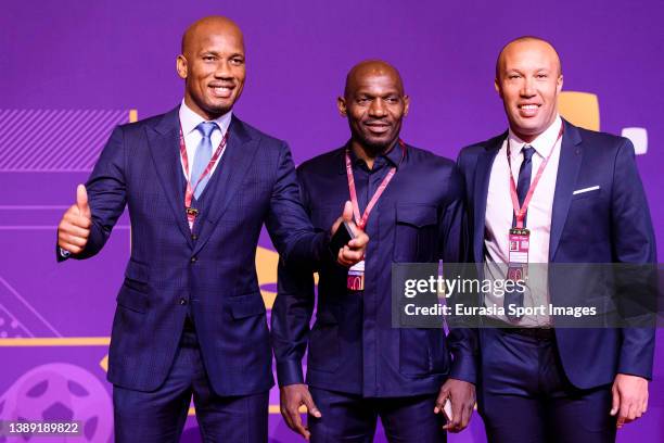 Didier Drogba, Geremi Njitap and Mikael Silvestre poses for photos on the red carpet prior the FIFA World Cup Qatar 2022 Final Draw at Doha...