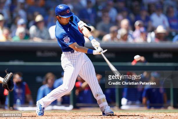 Seiya Suzuki of the Chicago Cubs hits a two-run home run against the Los Angeles Angels during the fourth inning of the MLB spring training game at...