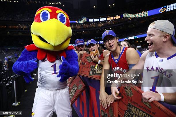 The Kansas Jayhawks mascot poses for a picture with fans prior to a game against the Villanova Wildcats during the 2022 NCAA Men's Basketball...