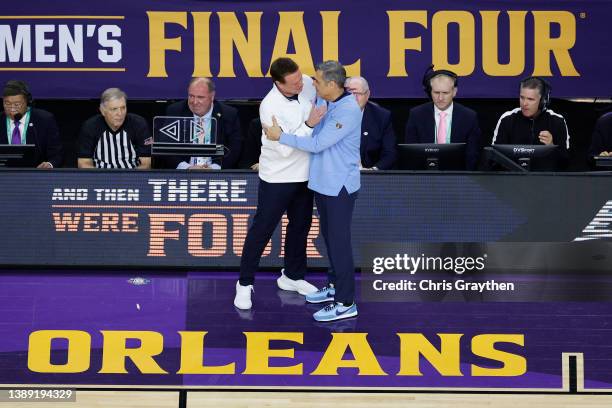 Head coach Bill Self of the Kansas Jayhawks and head coach Jay Wright of the Villanova Wildcats embrace before the game during the 2022 NCAA Men's...