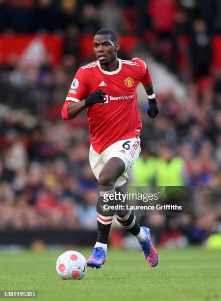 Paul Pogba of Manchester United runs with the ball during the Premier League match between Manchester United and Leicester City at Old Trafford on...
