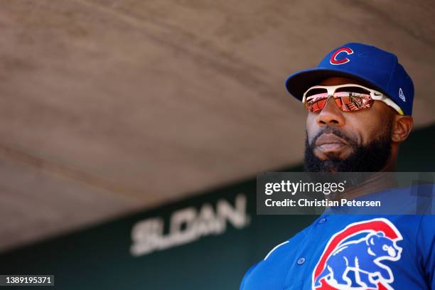 Jason Heyward of the Chicago Cubs watches from the dugout during the first inning of the MLB spring training game against the Los Angeles Angels at...