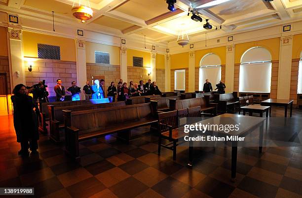 Members of the media tour a courtroom that was the site of the Las Vegas Kefauver Committee hearing at The Mob Museum February 13, 2012 in Las Vegas,...
