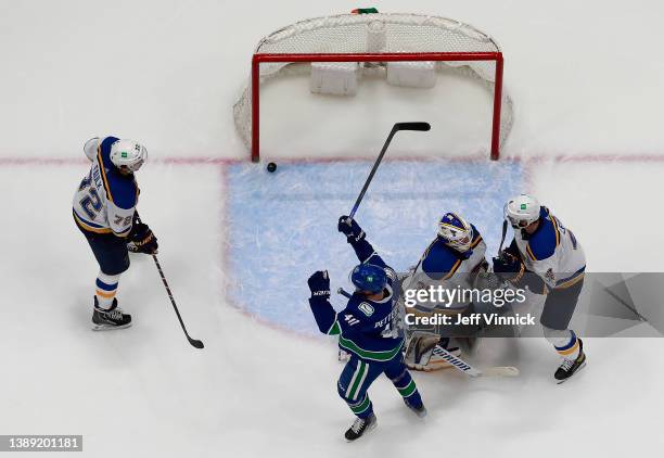 Elias Pettersson of the Vancouver Canucks celebrates his goal on Ville Husso of the St. Louis Blues during their NHL game at Rogers Arena March 30,...