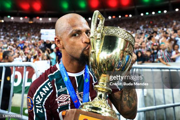 Felipe Melo of Fluminense celebrates with the trophy after winning the Campeonato Carioca 2022 against Flamengo as at Maracana Stadium on April 02,...