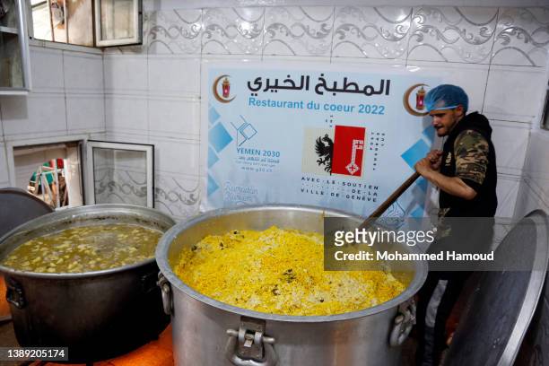 Unpaid workers make free meals provided by a charitable kitchen in the Mseek area on April 02, 2022 in Sana'a, Yemen. A two-month nationwide truce in...