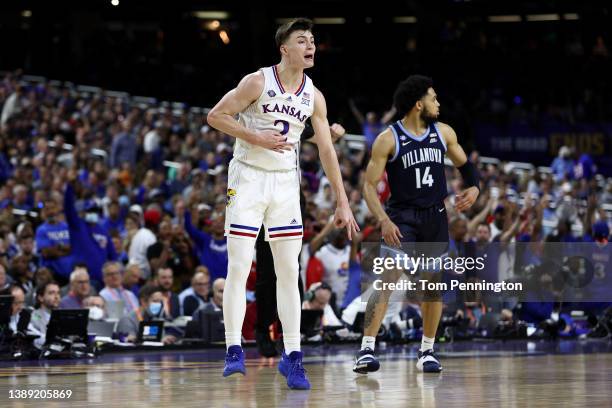 Christian Braun of the Kansas Jayhawks reacts to scoring three points in the second half of the game against the Villanova Wildcats during the 2022...