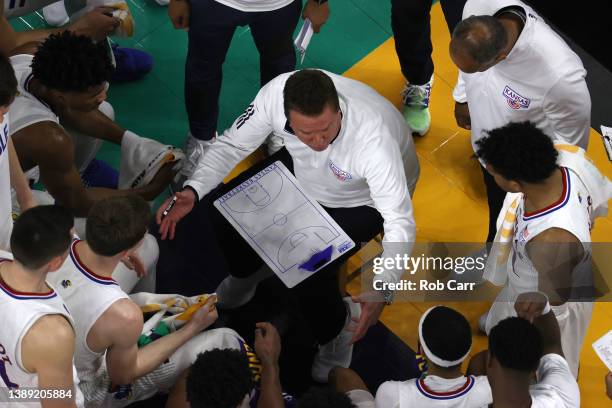 Head coach Bill Self of the Kansas Jayhawks talks with his team during a timeout in the second half of the game against the Villanova Wildcats during...