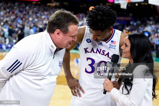 Ochai Agbaji and head coach Bill Self of the Kansas Jayhawks are interviewed by Tracy Wolfson after defeating the Villanova Wildcats in the semifinal...