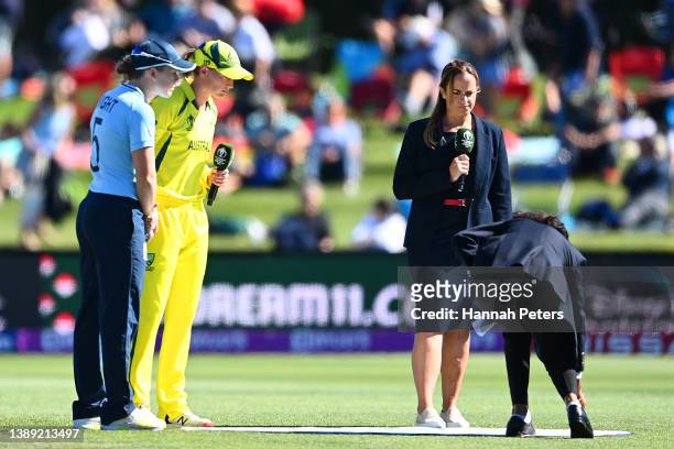The captains Heather Knight of England and Meg Lanning of Australia take part in the coin toss ahead of the 2022 ICC Women's Cricket World Cup Final...