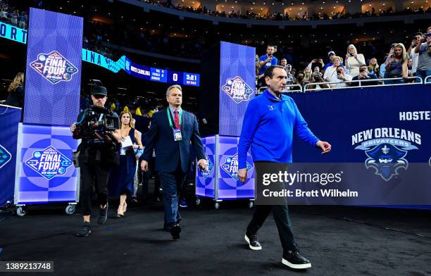 Head coach Mike Krzyzewski of the Duke Blue Devils walks to the court before taking on the North Carolina Tar Heels in the semifinal game of the 2022...