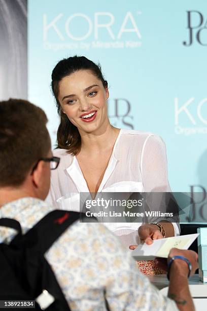 Australian model, Miranda Kerr greets fans during a KORA Organics skincare products promotion on Valentines day at David Jones on February 14, 2012...