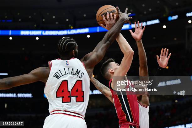Patrick Williams of the Chicago Bulls blocks the shot of Tyler Herro of the Miami Heat in the first half at United Center on April 02, 2022 in...