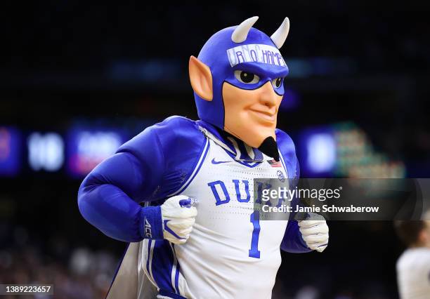 The Duke Blue Devils' mascot runs on the court as they take on the North Carolina Tar Heels during the first half in the semifinal game of the 2022...