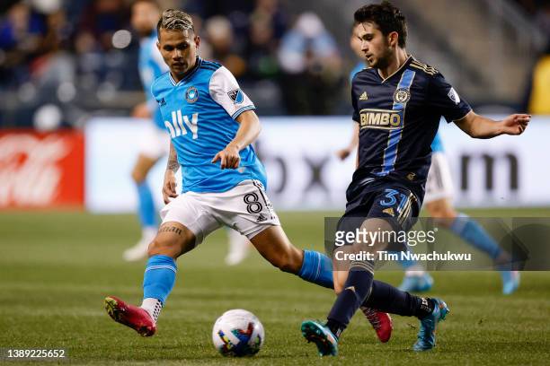 Leon Flach of Philadelphia Union passes past Jordy Alcívar of Charlotte FC during the first half at Subaru Park on April 02, 2022 in Chester,...