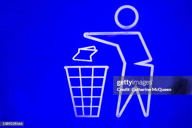 graphic of person disposing trash in waste receptacle on public sidewalk - encouragement icon stock pictures, royalty-free photos & images