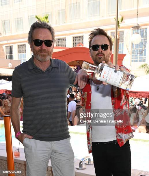 Actor Bryan Cranston and actor Aaron Paul attend Tao Beach Dayclub opening a The Venetian® Resort Las Vegas on April 02, 2022 in Las Vegas, Nevada.