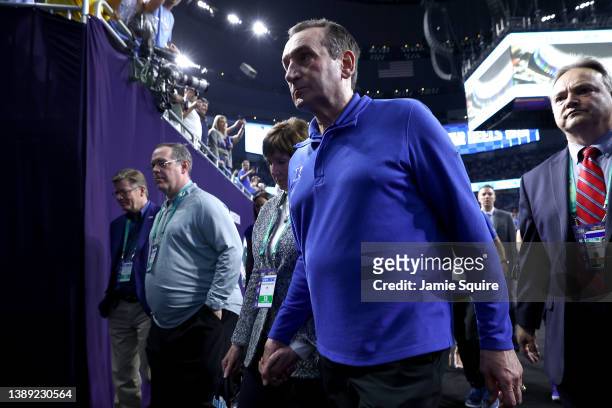 Head coach Mike Krzyzewski of the Duke Blue Devils walks off the court after losing to the North Carolina Tar Heels 81-77 in the 2022 NCAA Men's...