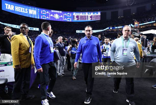 Head coach Mike Krzyzewski of the Duke Blue Devils walks off the court after losing to the North Carolina Tar Heels 81-77 in the 2022 NCAA Men's...