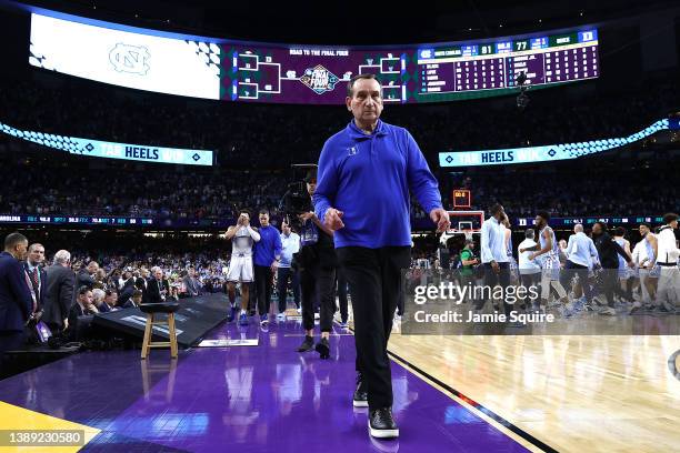 Head coach Mike Krzyzewski of the Duke Blue Devils walks off the court after losing to the North Carolina Tar Heels 81-77 in the 2022 NCAA Men's...