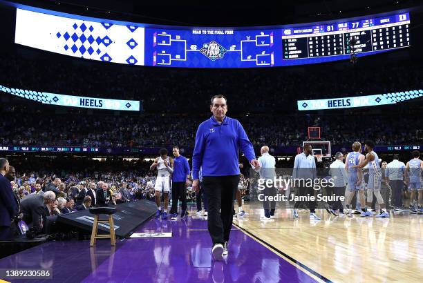 Head coach Mike Krzyzewski of the Duke Blue Devils walks off the court after losing to the North Carolina Tar Heels 81-77 in the 2022 NCAA Men's...