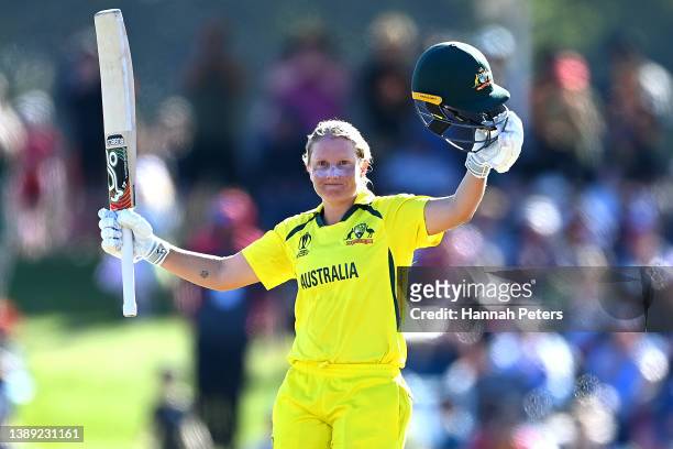 Alyssa Healy of Australia celebrates her century during the 2022 ICC Women's Cricket World Cup Final match between Australia and England at Hagley...
