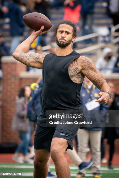 Colin Kaepernick participates in a throwing exhibition during half time of the Michigan spring football game at Michigan Stadium on April 2, 2022 in...