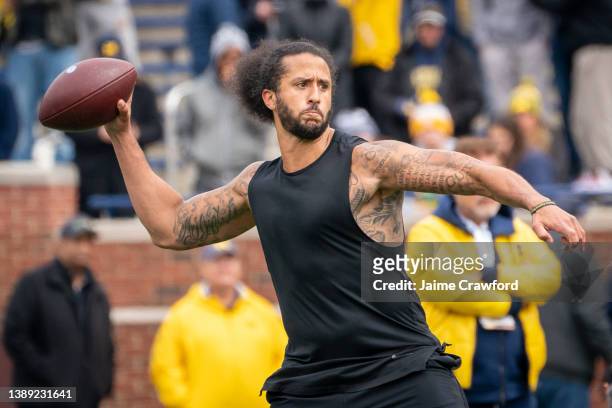 Colin Kaepernick participates in a throwing exhibition during half time of the Michigan spring football game at Michigan Stadium on April 2, 2022 in...