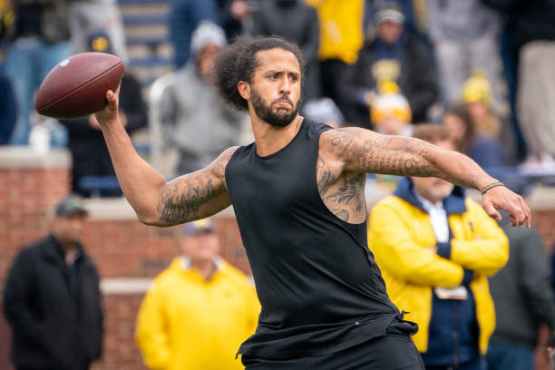 Colin Kaepernick participates in a throwing exhibition during half time of the Michigan spring football game at Michigan Stadium on April 2, 2022 in...