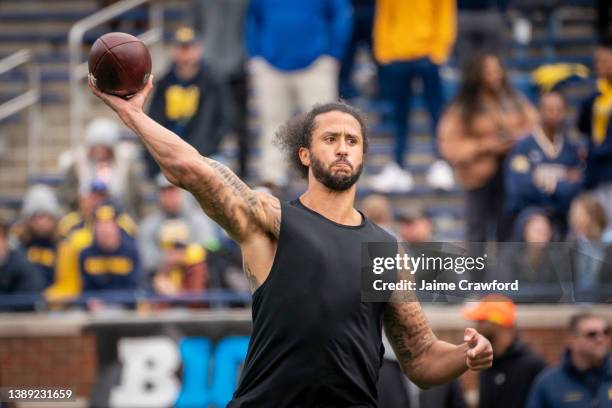 Colin Kaepernick participates in a throwing exhibition during half time of the Michigan spring football game at Michigan Stadium on April 2, 2022 in...