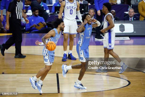 Leaky Black and R.J. Davis of the North Carolina Tar Heels react after defeating the Duke Blue Devils 81-77 in the second half of the game during the...