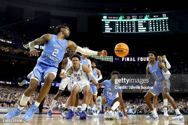 Caleb Love of the North Carolina Tar Heels reaches out for the ball in the second half of the game against the Duke Blue Devils during the 2022 NCAA...