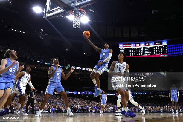 Caleb Love of the North Carolina Tar Heels shoots the ball in the second half of the game against the Duke Blue Devils during the 2022 NCAA Men's...