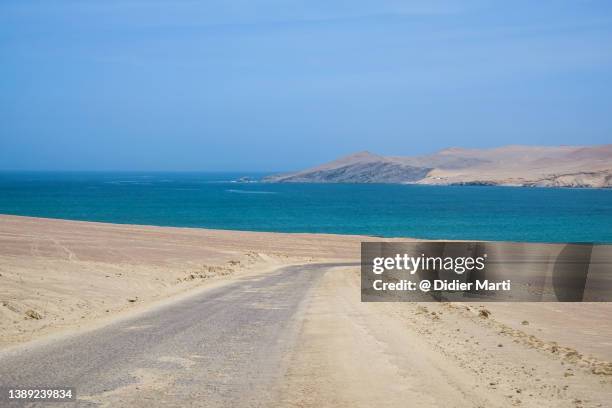 the road in the paracas peninsula in peru - pisco peru stock pictures, royalty-free photos & images