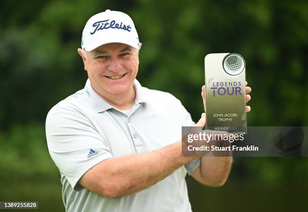 Stephen Dodd of Wales holds the Legends Tour John Jacobs trophy for winning the 2021 season order of merit at Constance Belle Mare Plage on April 03,...