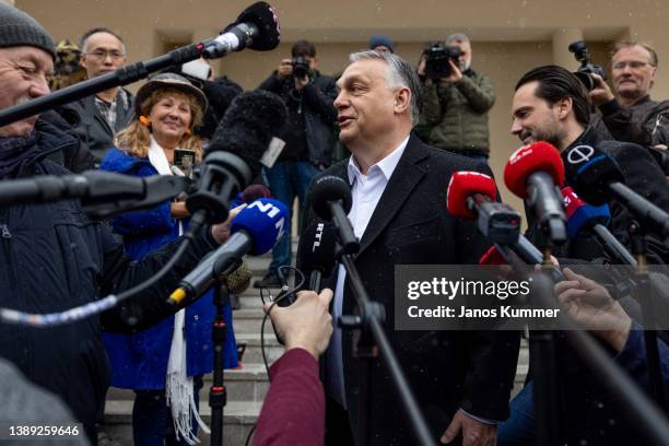 Hungarian Prime Minister Viktor Orban speaks to media after casting his ballots during the general parliamentary elections on April 3, 2022 in...