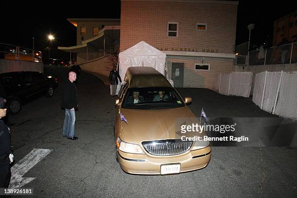 The car carrying Whitney Houston's body arrives at Whigham Funeral Home ahead of her funeral on February 13, 2012 in Newark, New Jersey.