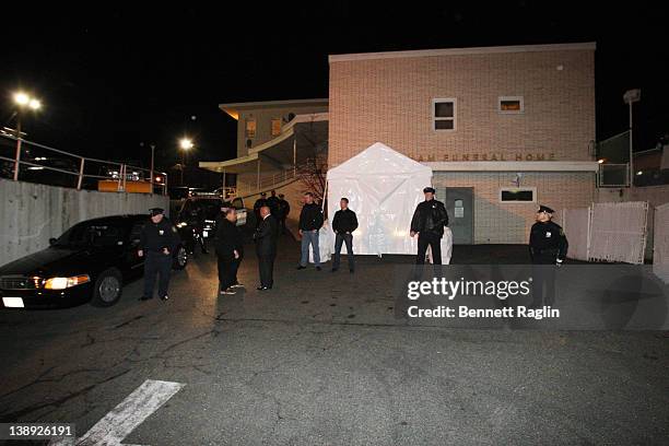 Police officers stand guard outside the Whigham funeral home prior to the arrival Whitney Houston's body at Whigham Funeral Home on February 13, 2012...