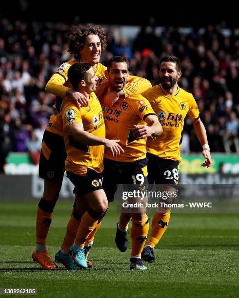 Jonny Otto of Wolverhampton Wanderers celebrates with teammates after scoring his team's first goal during the Premier League match between...