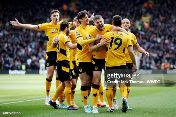 Jonny Otto of Wolverhampton Wanderers celebrates with teammates after scoring his team's first goal during the Premier League match between...