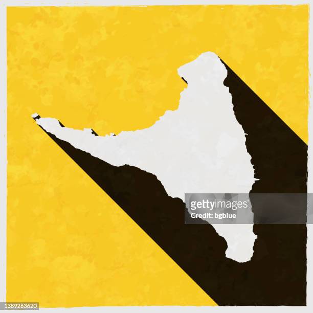 anjouan map with long shadow on textured yellow background - anjouan island stock illustrations