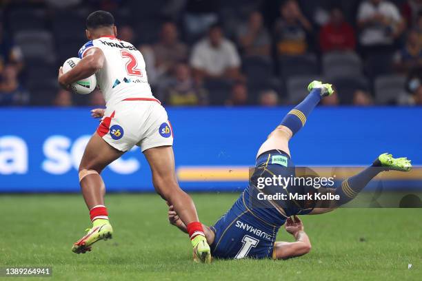 Mathew Feagai of the Dragons fends off Clinton Gutherson of the Eels during the round four NRL match between the Parramatta Eels and the St George...
