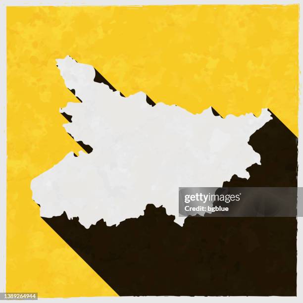 bihar map with long shadow on textured yellow background - bihar stock illustrations