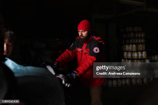 Ukrainian Red Cross volunteers offload humanitarian aid brought to Ukraine by the Romanian Red Cross, on April 2, 2022 in Tysmenytsya, Ukraine. Since...