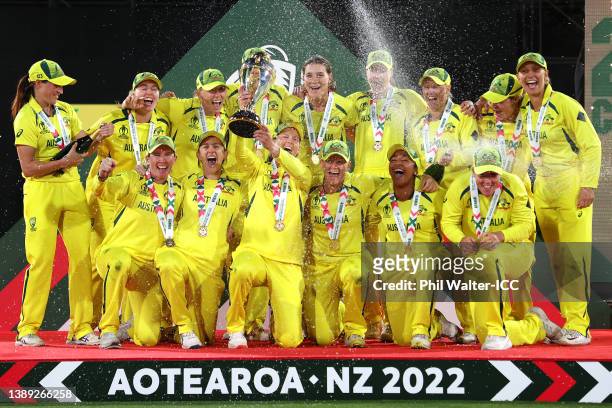 Australia celebrate with the trophy after winning the 2022 ICC Women's Cricket World Cup Final match between Australia and England at Hagley Oval on...