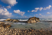 Windy and Rocky Coastline of the Mediterranean Sea in the Marsa Matruh city under Blue Cloudy sky with no People around