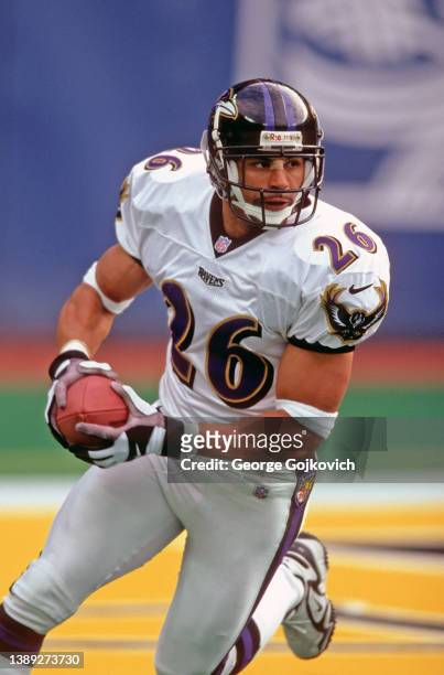 Punt returner Rod Woodson of the Baltimore Ravens runs with the football against the Pittsburgh Steelers during a game at Three Rivers Stadium on...